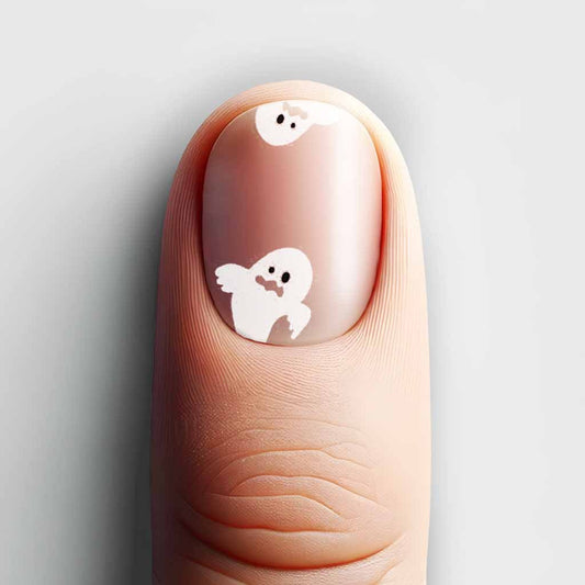 Close-up of Printworks' Ghost nail design, featuring playful white ghosts against a natural nail background.