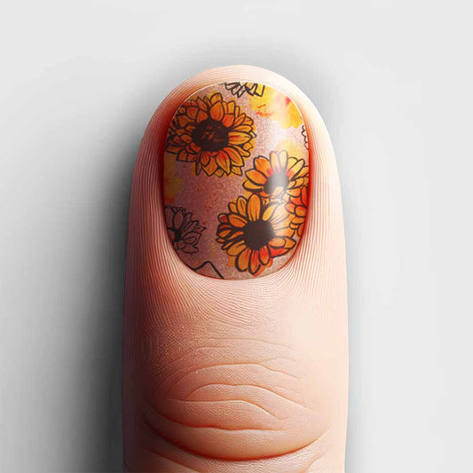 Close-up of a nail with vibrant Summer Sunflower nail wrap design.